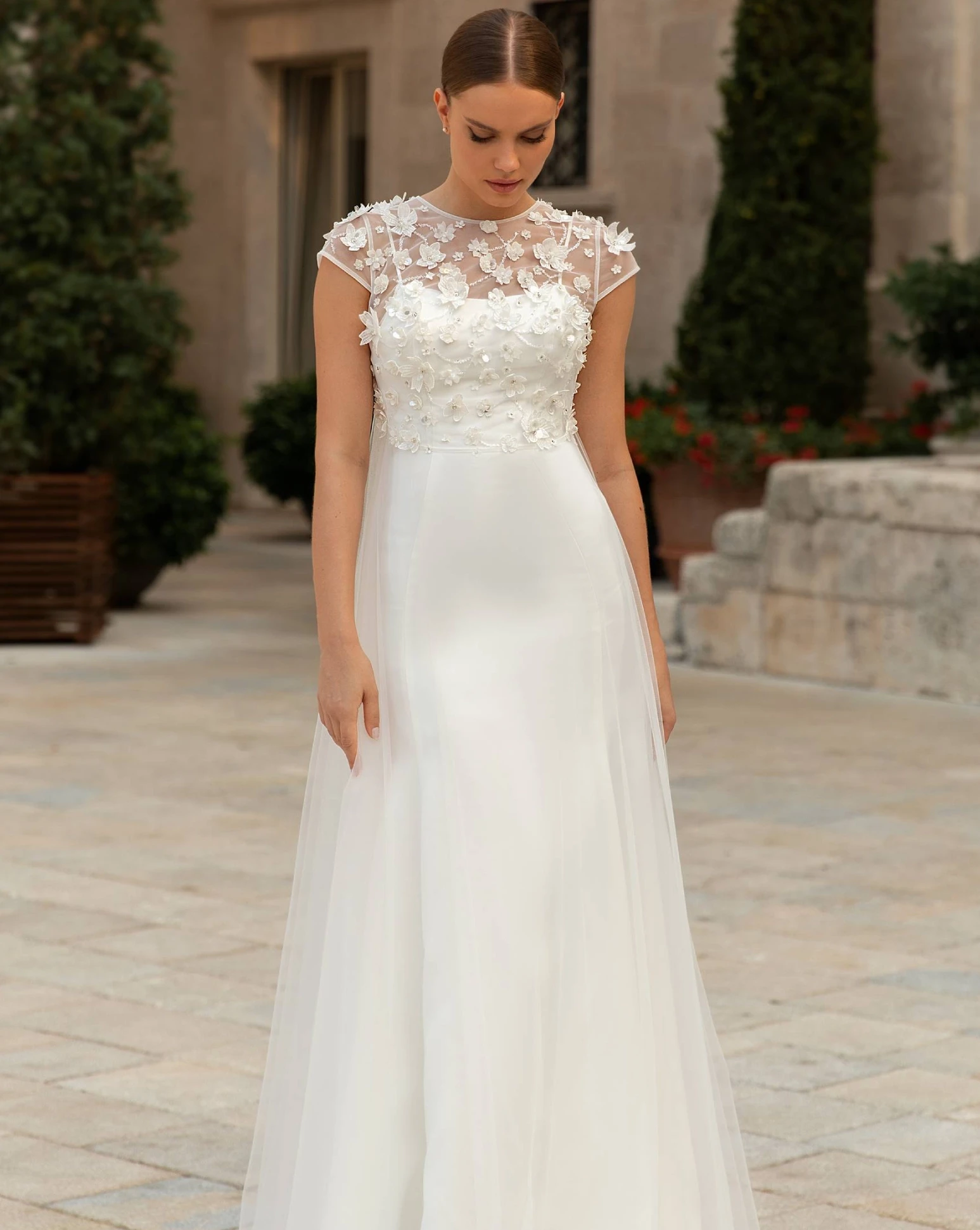 Model wearing a Ballgowns style gown
